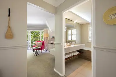 a bathroom with a sink and a mirror at Mont Rochelle Hotel and Vineyard in Franschhoek
