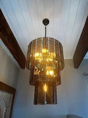 a large glass chandelier hanging from a ceiling at Eagleview Guesthouse in Hermanus