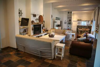 a living room with a couch and a table at Brander View in Hermanus