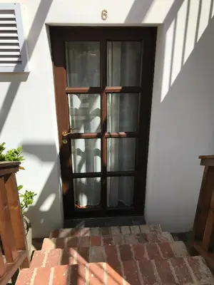 a door to a house with a brick staircase at Hoogeind Manor in Somerset West