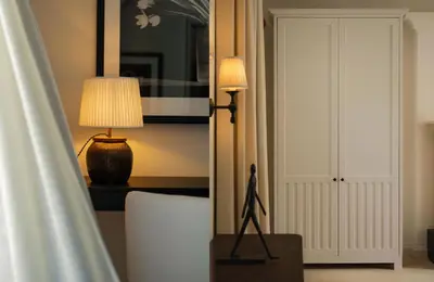 a statue of a man standing on a table in a room at Maison Cabrière Boutique Hotel in Franschhoek