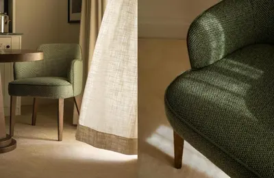 a green chair and a table in a room at Maison Cabrière Boutique Hotel in Franschhoek