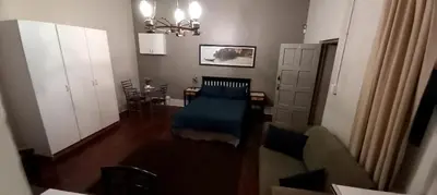 a living room with a couch and a table at Glen Lilly Self Catering in Parow