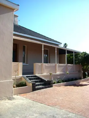 a house with stairs in front of it at Glen Lilly Self Catering in Parow
