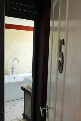 a bathroom with a sink and a bath tub at African Adventures Accommodation in Joostenberg Vlakte