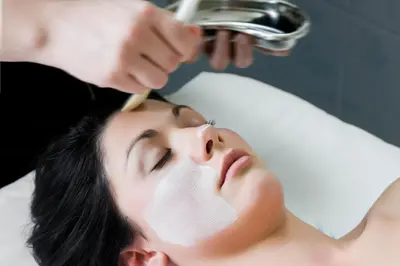a woman getting her face rejuvenated at a beauty salon at Coopmanhuijs Boutique Hotel & Spa in Stellenbosch
