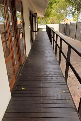 a wooden walkway leading up to a building at Dolliwarie Guesthouse in Panorama