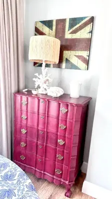 a pink dresser with a lamp on top of it at Kallistes Misty Shores Cottage in Bettyʼs Bay