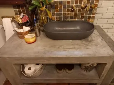 a large black bath tub on a table in a bathroom at Muratie Wine Estate in Stellenbosch
