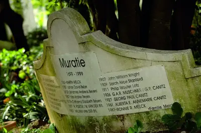 a stone grave with a sign on it at Muratie Wine Estate in Stellenbosch