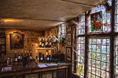 a bar with a stained glass window in a room at Muratie Wine Estate in Stellenbosch