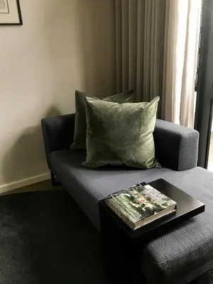 a living room with a couch and a table at Eikehoff Apartments in Stellenbosch