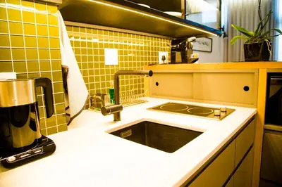 a kitchen with a sink and a counter top at Eikehoff Apartments in Stellenbosch