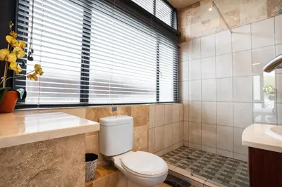 a bathroom with a toilet and a sink at Avemore Eikehoff No 23 - full Backup Power in Stellenbosch