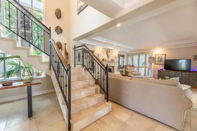 a staircase in a home with a living room at Maison du Cap in Cape Town
