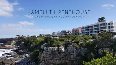 a view of the ocean and a beach with buildings at Hamewith Penthouse in Hermanus