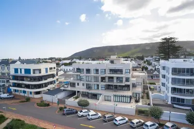 an aerial view of a city with buildings and cars at Hamewith Penthouse in Hermanus