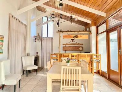 a dining room with a table and chairs at Villa V in Cape Town
