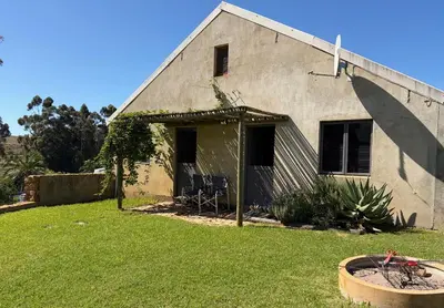 a house with a large yard in front of it at Shabach Farm in Hartebeest Rivier
