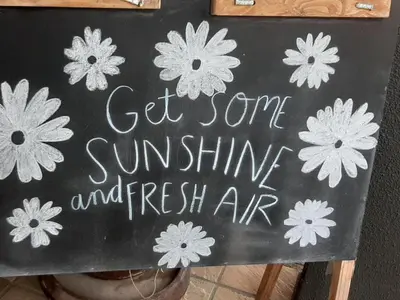 a sign that says get some sunshine and fresh air at Eversview Guesthouse in Durbanville