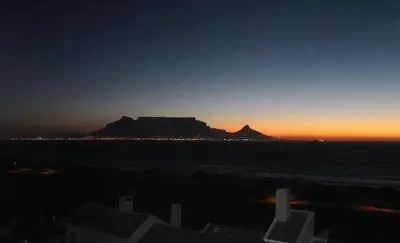a view of the table mountain at sunset at 605 Nautica in Bloubergstrand