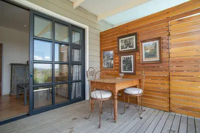a dining room with a table and two chairs at 29 Earlibelle in Stellenbosch