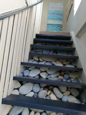 a set of stairs with rocks on them at Siesta in Hermanus