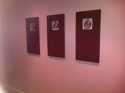 a row of four pictures on a wall at Nautilus Guest House in Hermanus