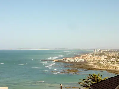a view of the ocean and a beach at Studio with unforgettable View in Gordonʼs Bay