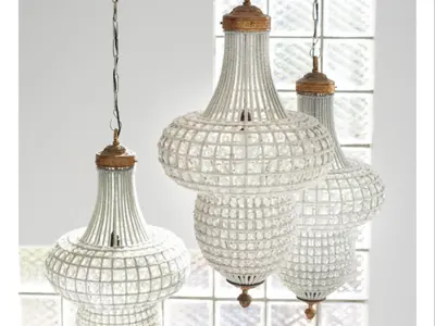 three white glass chandeliers hanging from a wall at Atlantic Oasis Guest House in Table View