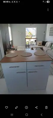 a living room with a table and a couch at Nagua bay in Gordonʼs Bay