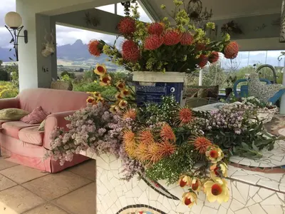 a vase filled with flowers on top of a table at Little Farm in Raithby