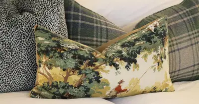 a pillow with a picture of a tree on a couch at Mount Grace Country House in Greyton