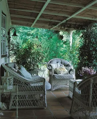 two wicker chairs sitting on a patio at High Hopes in Greyton