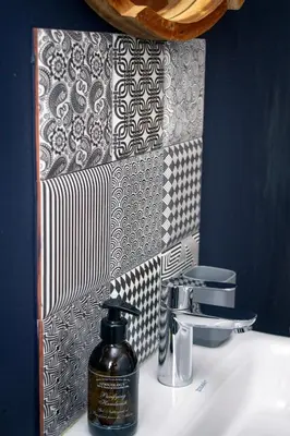 a bathroom sink with a bottle of soap on it at Olive tree private rooms in Stellenbosch- No Load Shedding in Stellenbosch