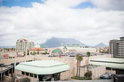 a view of a city with mountains in the background at Waters Edge Self-Catering Apartment in Cape Town