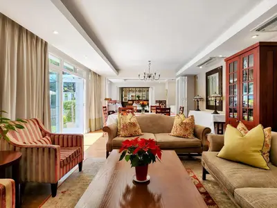 a living room with couches and a table at Roodenburg House in Cape Town