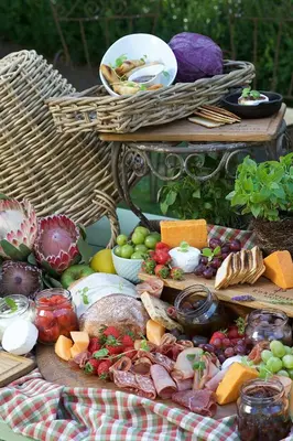 a table filled with lots of different types of food at Zorgvliet Wines Country Lodge in Stellenbosch