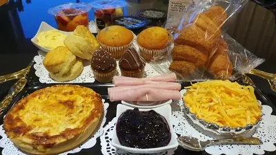 a table full of different types of muffins and desserts at Keret Accommodation in Bellville