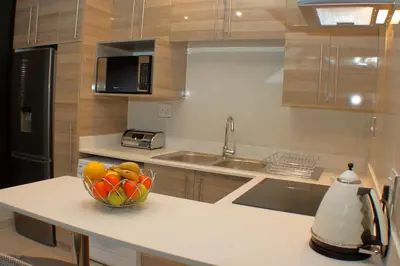 a bowl of fruit on a counter in a kitchen at Keret Accommodation in Bellville