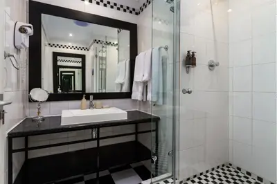a bathroom with a sink and a shower at Life & Leisure Boutique Guesthouse in Stellenbosch