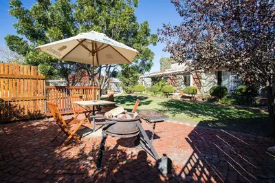 a patio with a table and an umbrella at Damas Guest Farm in Worcester