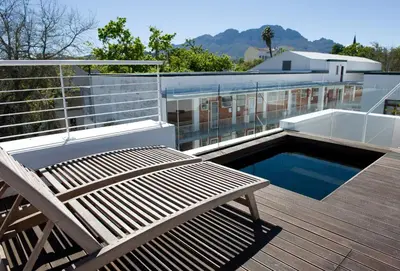 a deck with a bench and a pool on a building at 14 On Louw in Stellenbosch