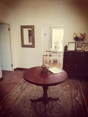 a living room with a table and a dining room at Induku in Stellenbosch