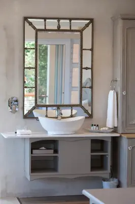 a bathroom with a sink and a mirror at Hermanus Boutique Guest House in Hermanus