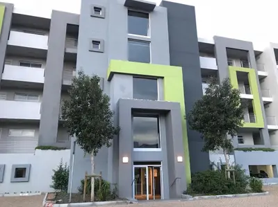 an image of a building with trees in front of it at 131 Yellowwood Ashton Park in Cape Town
