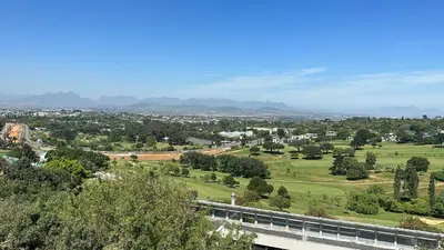 a view of a city with a bridge and trees at Welgemoed Villa in Bellville