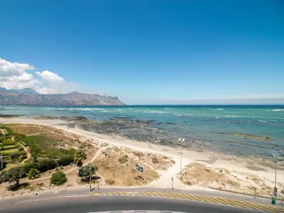 a view of a beach and the ocean at False Bay Inn in Strand
