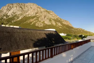 a view of a mountain from the roof of a building at Pacem cottage in Hermanus