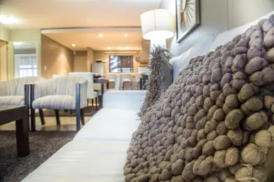 a row of chairs in a waiting room at Modern 2 bedroom with underground parking 1 mins from beach-205 La Cabina, Blouberg, Cape Town in Bloubergstrand